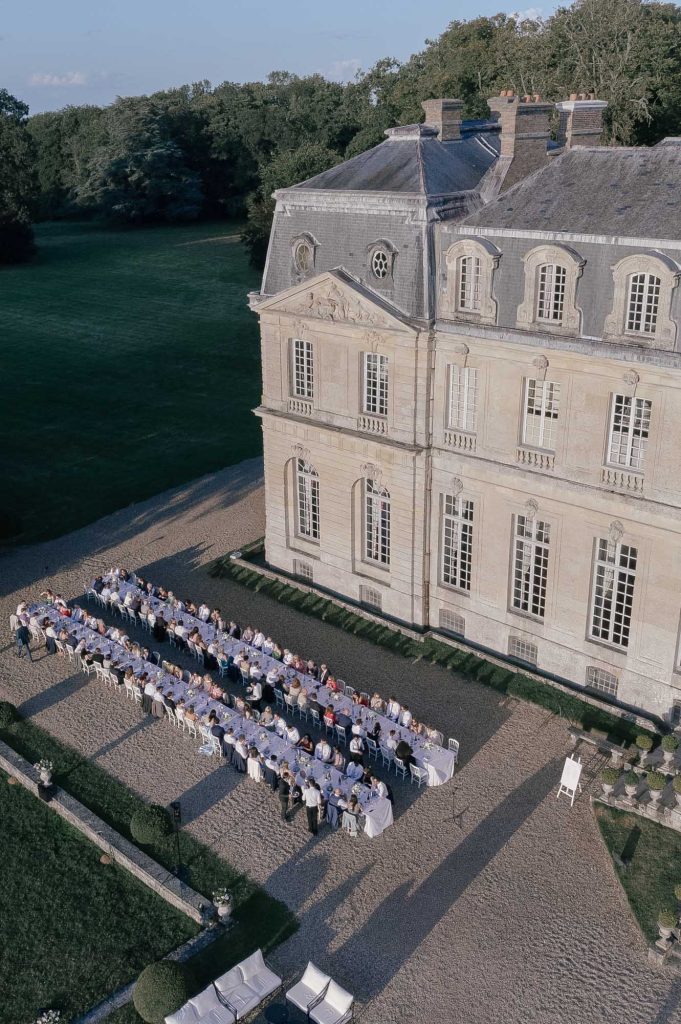 A wedding breakfast at a French chateau as seen from above, taken by London Wedding Photographer Philip White.